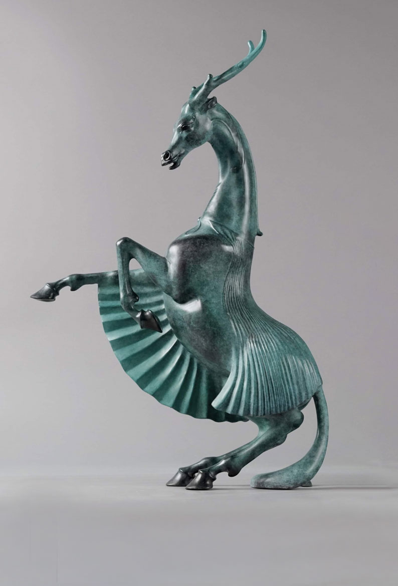 a statue of a horse deer with a wings