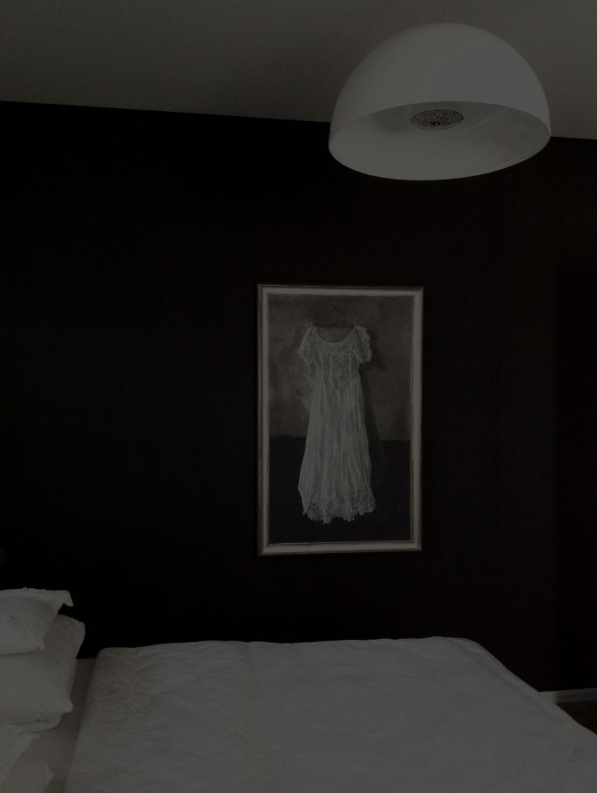 a picture of a dress on a black wall