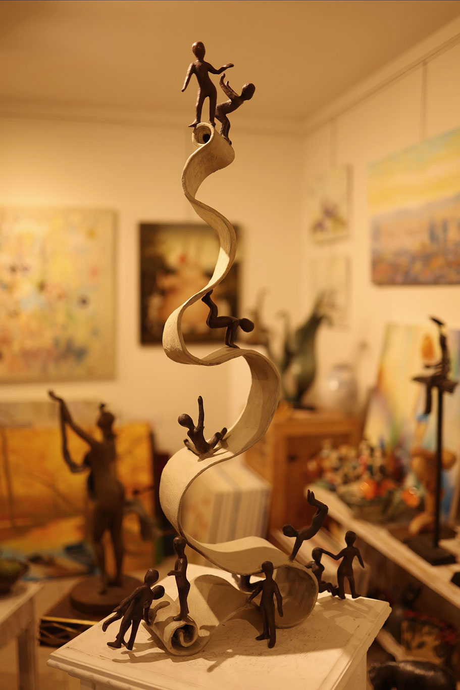 a room with paintings and pictures